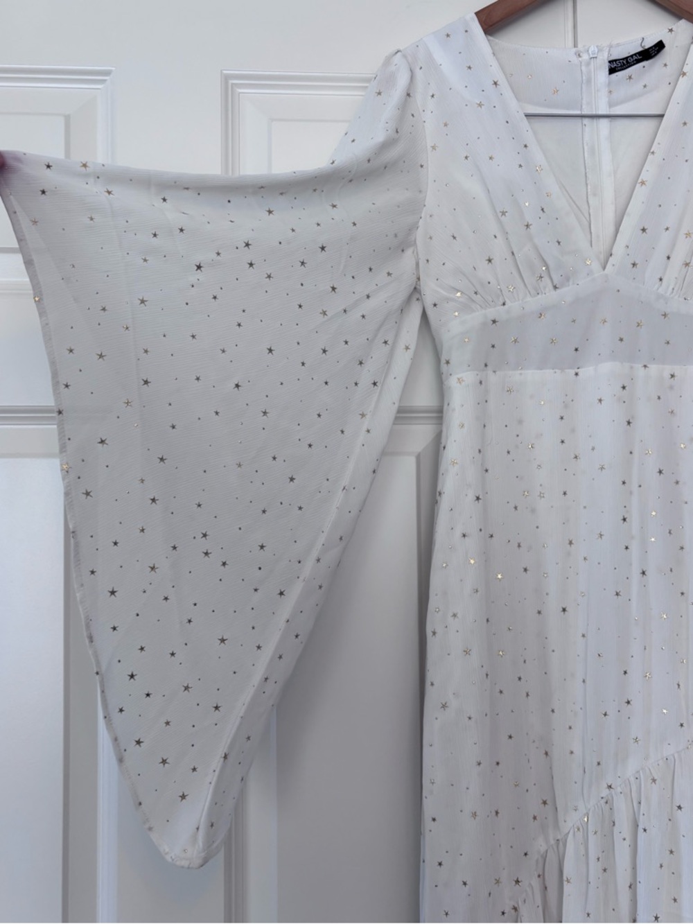 Bohemian white dress with gold stars and bell sleeves